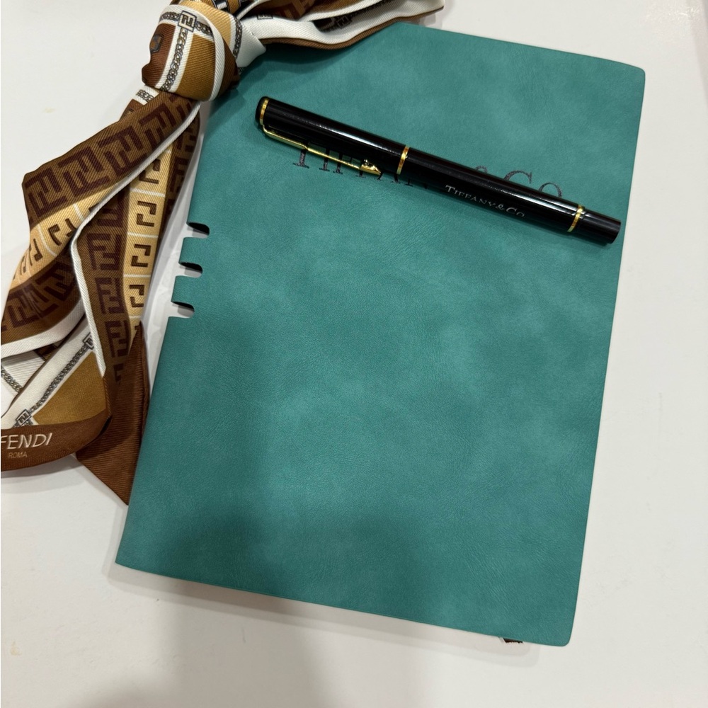 Turquoise Journal with Black Pen